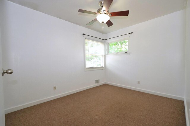 1578 N Thompson Dr, Bay Shore, NY 11706 - spare room featuring light carpet and ceiling fan