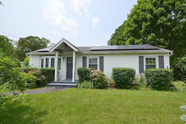 1578 N Thompson Dr, Bay Shore, NY 11706 - view of front of house featuring a front yard and solar panels