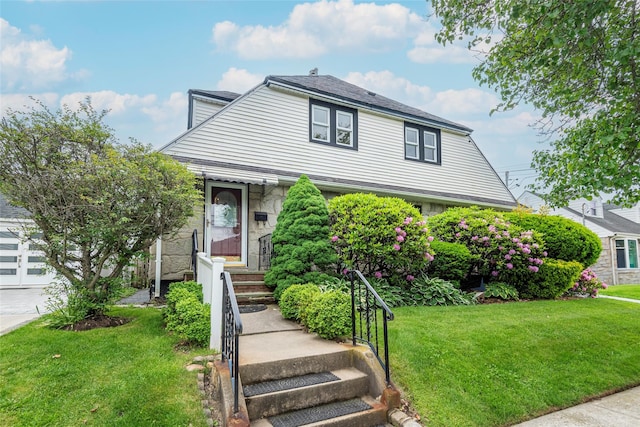 103 Fairfield Ave, Mineola, NY 11501 - view of front of property featuring a front yard and stone siding