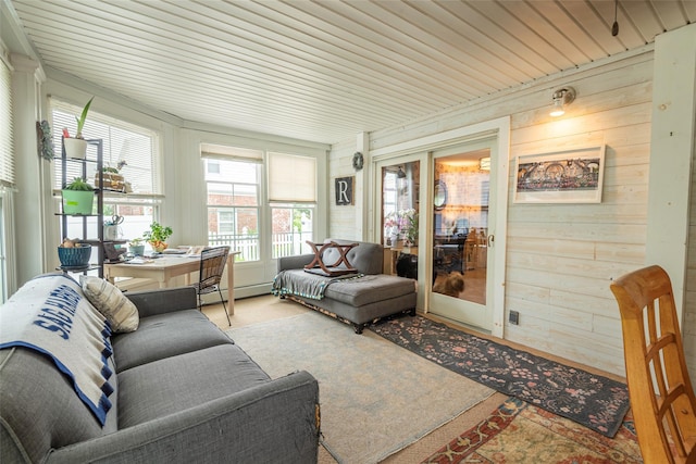 103 Fairfield Ave, Mineola, NY 11501 - sunroom featuring wooden walls, a baseboard heating unit, and carpet flooring