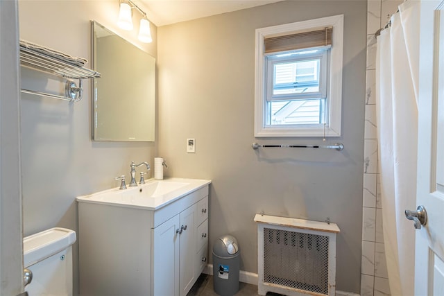 103 Fairfield Ave, Mineola, NY 11501 - bathroom featuring radiator, toilet, vanity, and a shower with curtain