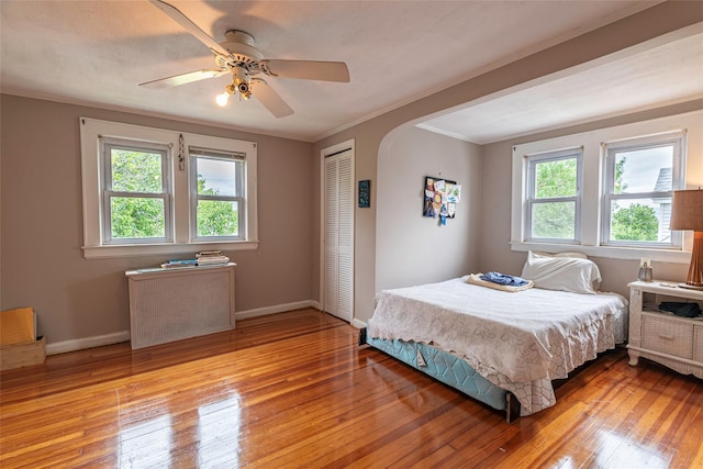 103 Fairfield Ave, Mineola, NY 11501 - bedroom with a closet, light wood finished floors, baseboards, and ornamental molding