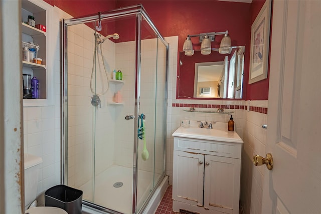 103 Fairfield Ave, Mineola, NY 11501 - bathroom with a stall shower, vanity, tile walls, toilet, and tile patterned floors