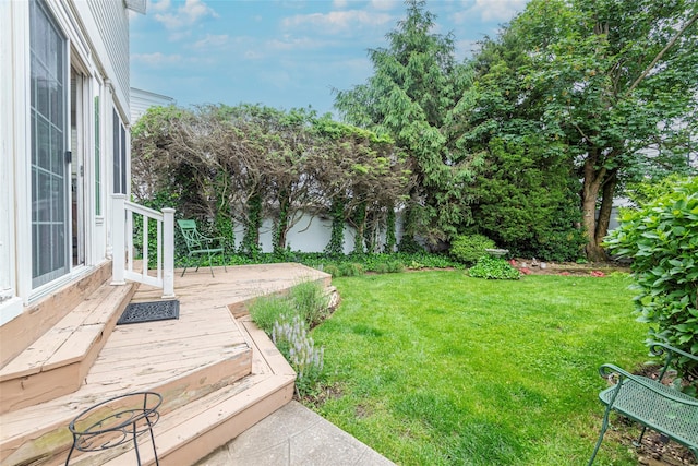 103 Fairfield Ave, Mineola, NY 11501 - view of green lawn with a wooden deck