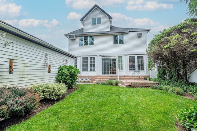 103 Fairfield Ave, Mineola, NY 11501 - rear view of property featuring a lawn, a deck, and roof with shingles