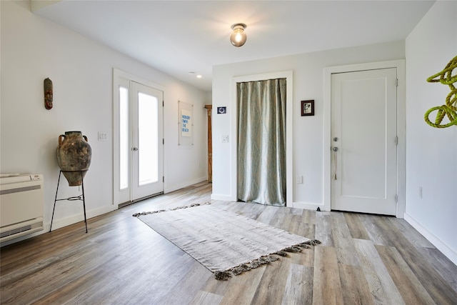 546 Willowemoc Rd, Livingston Manor, NY 12758 - entryway with wood finished floors, heating unit, baseboards, and recessed lighting