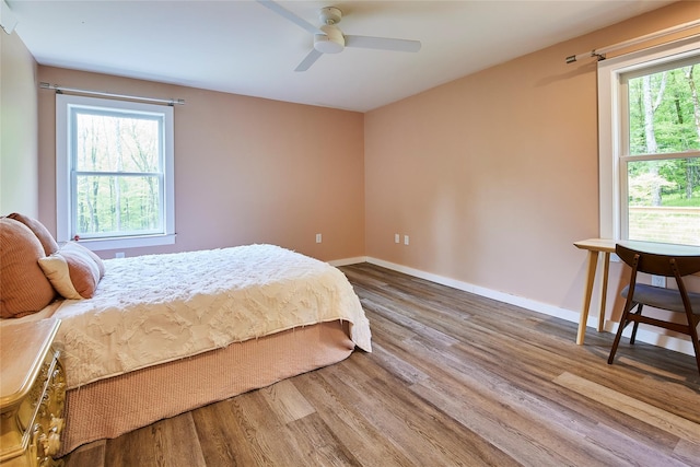 546 Willowemoc Rd, Livingston Manor, NY 12758 - bedroom with wood finished floors, baseboards, and a ceiling fan