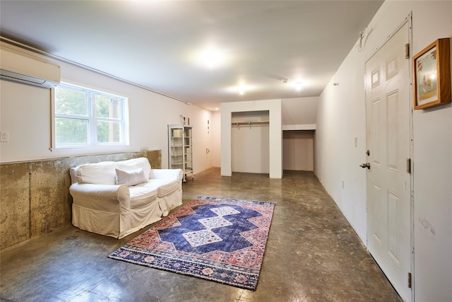 546 Willowemoc Rd, Livingston Manor, NY 12758 - living area with a wall unit AC and concrete flooring