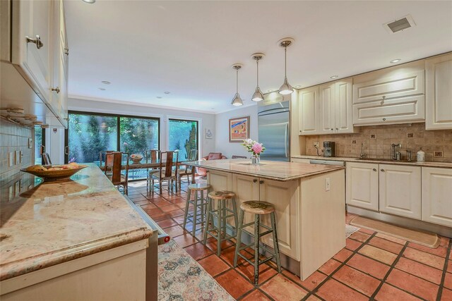51 Eagle Chase, Woodbury, NY 11797 - kitchen with stainless steel built in fridge, a sink, tasteful backsplash, a center island, and a breakfast bar