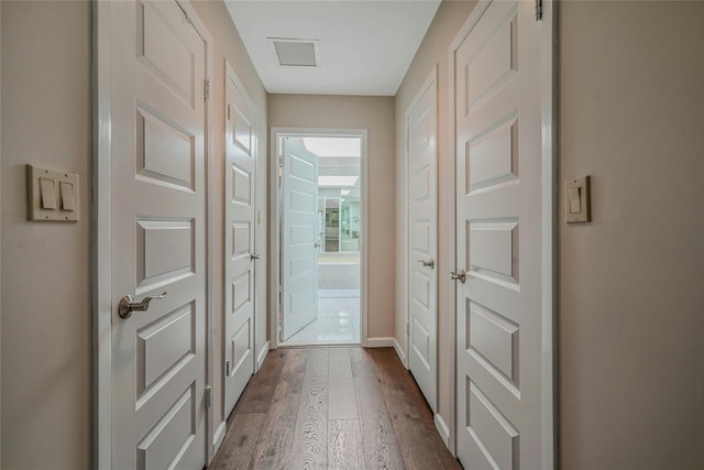 51 Eagle Chase, Woodbury, NY 11797 - hallway with dark wood-style floors and baseboards