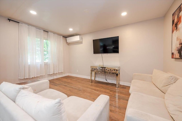 3739 Barnes Ave, Bronx, NY 10467 - living room with a wall unit AC, wood finished floors, recessed lighting, and baseboards
