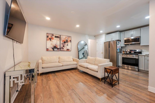 3739 Barnes Ave, Bronx, NY 10467 - living room featuring wood finished floors and recessed lighting