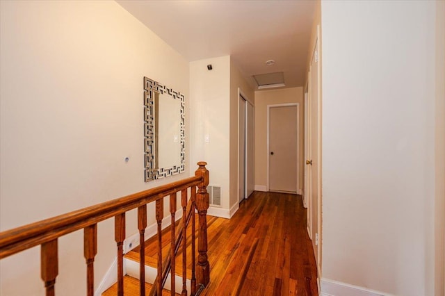 3739 Barnes Ave, Bronx, NY 10467 - hallway with wood finished floors, an upstairs landing, attic access, and baseboards