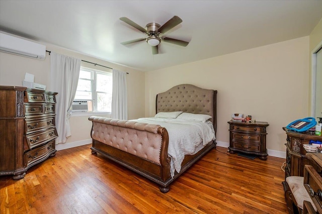 3739 Barnes Ave, Bronx, NY 10467 - bedroom with a wall mounted air conditioner, wood finished floors, baseboards, and cooling unit