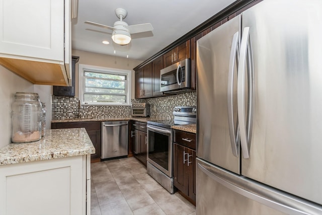 352 N State Rd Unit 2H, Briarcliff Manor, NY 10510 - kitchen with stainless steel appliances, a ceiling fan, dark brown cabinetry, tasteful backsplash, and light stone counters