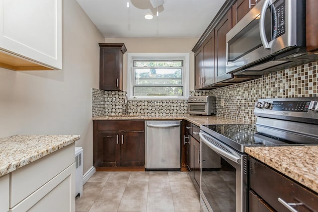 352 N State Rd Unit 2H, Briarcliff Manor, NY 10510 - kitchen featuring stainless steel appliances, a sink, and dark brown cabinets