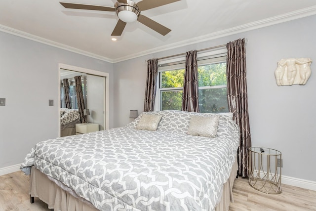352 N State Rd Unit 2H, Briarcliff Manor, NY 10510 - bedroom with baseboards, light wood-type flooring, a closet, and ornamental molding