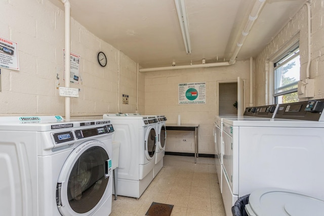 352 N State Rd Unit 2H, Briarcliff Manor, NY 10510 - communal laundry room with washing machine and dryer and concrete block wall