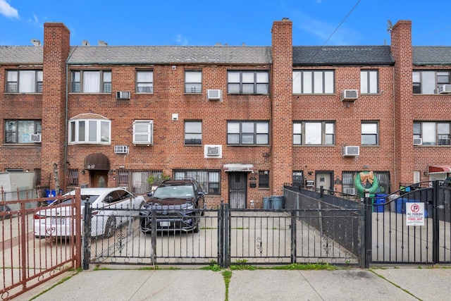 23-19 93rd St, East Elmhurst, NY 11369 - view of property with uncovered parking and a fenced front yard