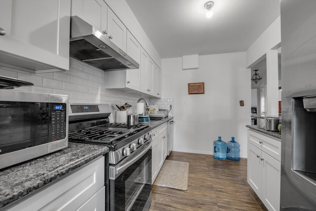 23-19 93rd St, East Elmhurst, NY 11369 - kitchen with stainless steel appliances, exhaust hood, backsplash, and white cabinets