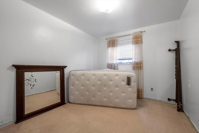 23-19 93rd St, East Elmhurst, NY 11369 - unfurnished bedroom with tile patterned floors and lofted ceiling