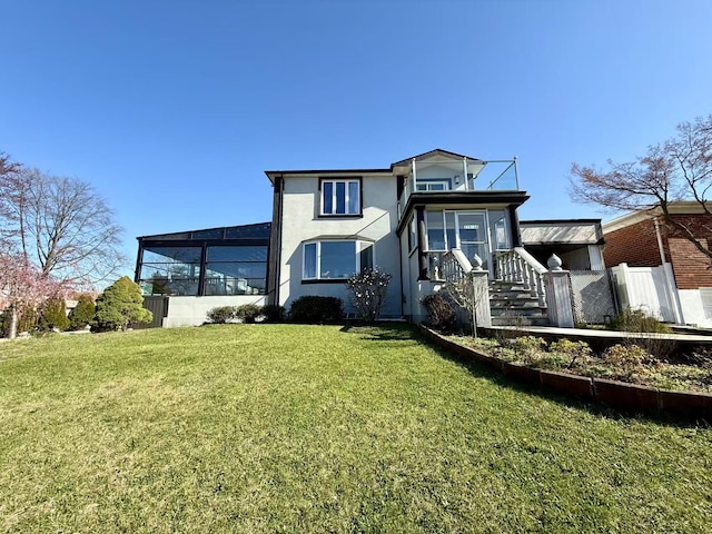 215-48 24th Ave, Bayside, NY 11360 - back of house featuring a lawn and stucco siding