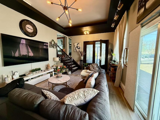 215-48 24th Ave, Bayside, NY 11360 - living room with wood finished floors, a chandelier, stairs, and a raised ceiling