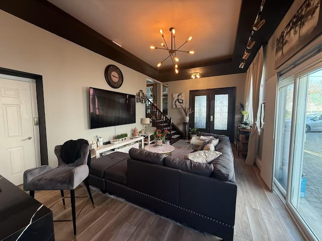 215-48 24th Ave, Bayside, NY 11360 - living room featuring wood finished floors, a chandelier, stairs, french doors, and a tray ceiling
