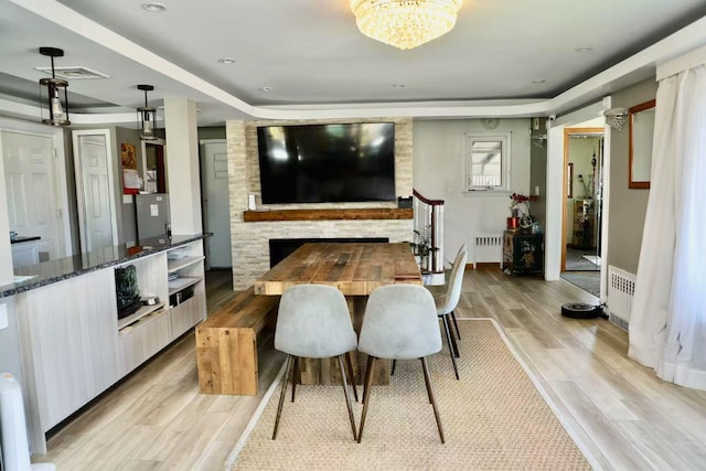 215-48 24th Ave, Bayside, NY 11360 - dining space featuring radiator, light wood-style floors, a chandelier, and baseboards