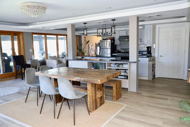 215-48 24th Ave, Bayside, NY 11360 - dining space with light wood-type flooring, a chandelier, and recessed lighting