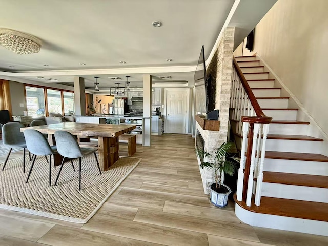 215-48 24th Ave, Bayside, NY 11360 - dining area featuring stairs and light wood-style flooring