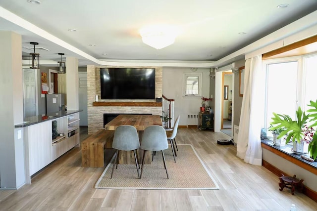 215-48 24th Ave, Bayside, NY 11360 - dining room with light wood finished floors, baseboards, and radiator heating unit