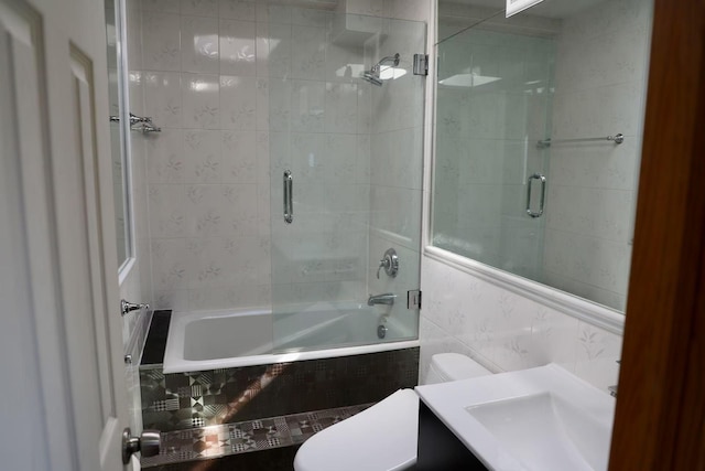215-48 24th Ave, Bayside, NY 11360 - full bathroom with tile walls, tiled shower / bath, toilet, and vanity