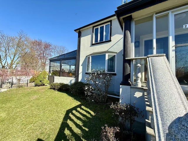 215-48 24th Ave, Bayside, NY 11360 - back of house featuring stucco siding and a lanai