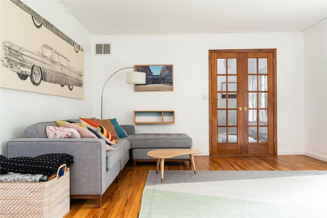 8 Margaret Dr, Hopewell Junction, NY 12533 - living room featuring wood finished floors and french doors