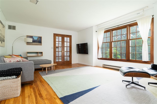 8 Margaret Dr, Hopewell Junction, NY 12533 - living room featuring wood finished floors, french doors, and baseboards