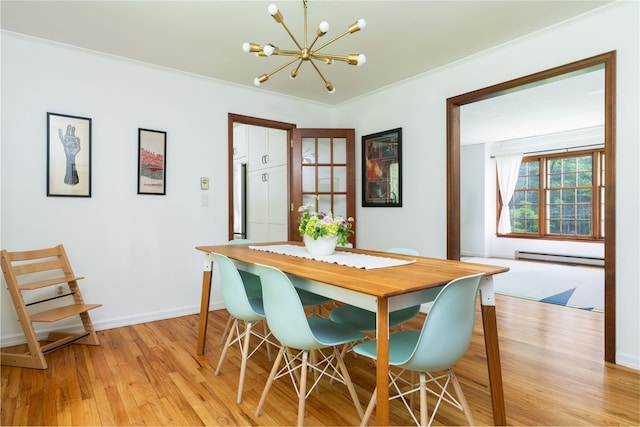 8 Margaret Dr, Hopewell Junction, NY 12533 - dining room featuring a chandelier, light wood finished floors, baseboard heating, and baseboards