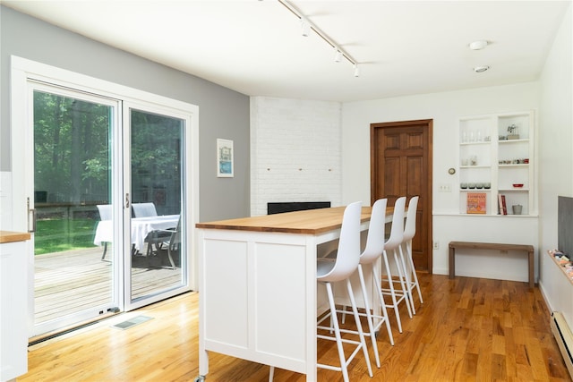 8 Margaret Dr, Hopewell Junction, NY 12533 - kitchen featuring wooden counters, track lighting, white cabinetry, and light wood-style flooring