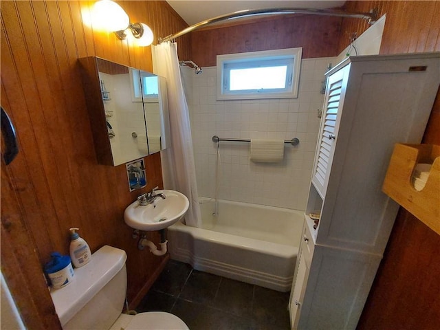 460 E Front St, Hancock, NY 13783 - full bath with toilet, tile patterned flooring, shower / bath combo, wooden walls, and a sink
