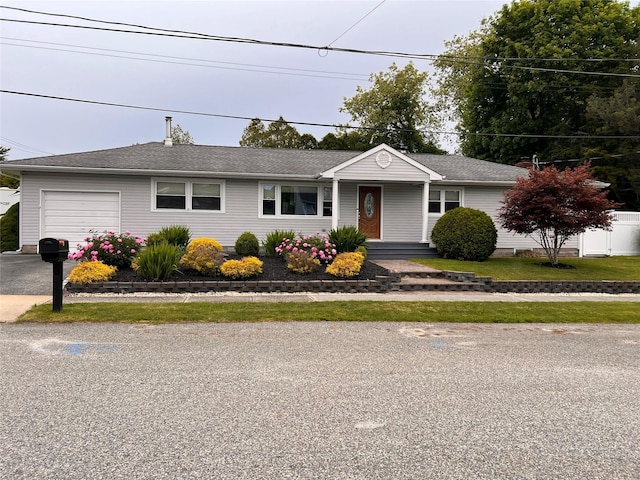 2 Merritt Ln, Center Moriches, NY 11934 - ranch-style home featuring an attached garage and driveway