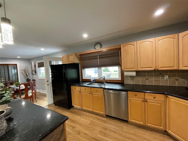 2 Merritt Ln, Center Moriches, NY 11934 - kitchen featuring stainless steel dishwasher, freestanding refrigerator, a sink, light wood finished floors, and backsplash