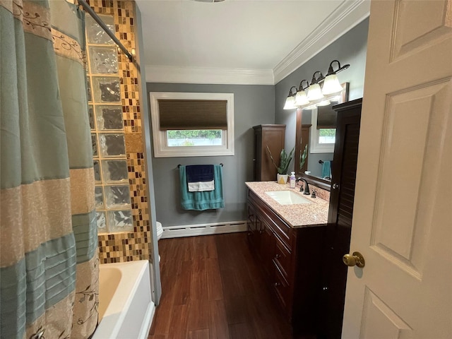 2 Merritt Ln, Center Moriches, NY 11934 - bathroom with a baseboard heating unit, ornamental molding, vanity, wood finished floors, and plenty of natural light