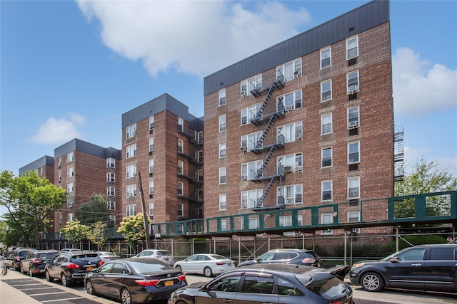 83-37 Saint James Ave Unit 2R, Elmhurst, NY 11373 - view of apartment building / complex with uncovered parking