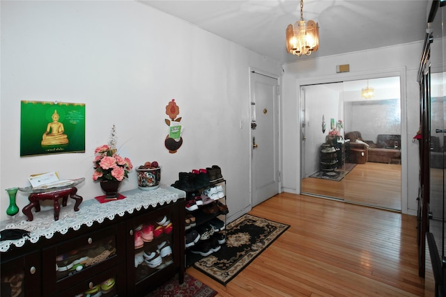 83-37 Saint James Ave Unit 2R, Elmhurst, NY 11373 - entrance foyer with a chandelier and wood finished floors