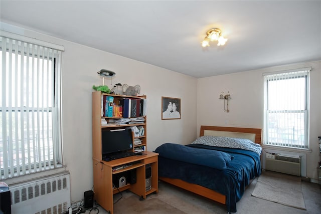83-37 Saint James Ave Unit 2R, Elmhurst, NY 11373 - bedroom with radiator heating unit, carpet floors, and an AC wall unit
