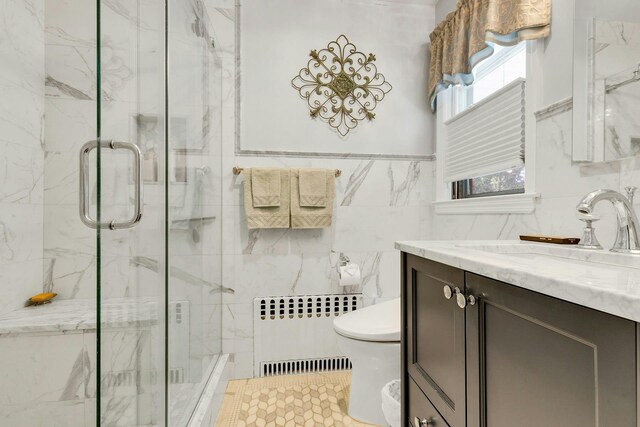 7 Woods Rd, Locust Valley, NY 11560 - full bath with radiator heating unit, tile walls, toilet, vanity, and a marble finish shower