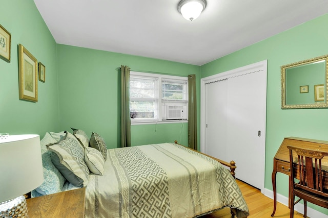 7 Woods Rd, Locust Valley, NY 11560 - bedroom with light wood-type flooring and a closet