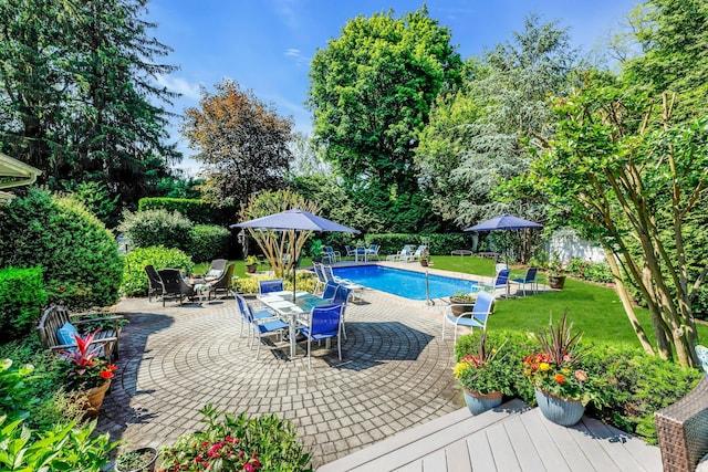 7 Woods Rd, Locust Valley, NY 11560 - view of swimming pool with a patio area, outdoor dining space, and view of scattered trees