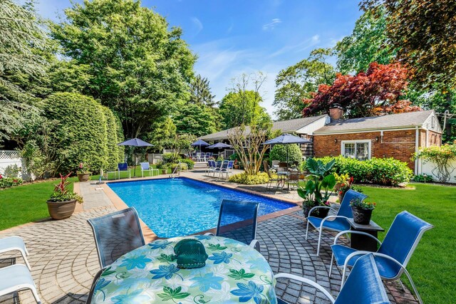 7 Woods Rd, Locust Valley, NY 11560 - view of pool with outdoor dining space and a patio area