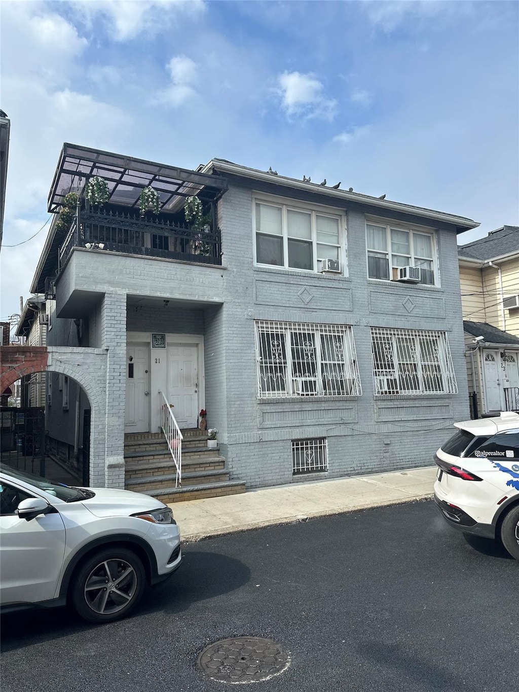 21 Brighton 10th Path, Brooklyn, NY 11235 - multi unit property with a balcony and brick siding